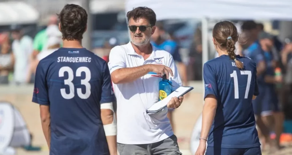 Coach talking to his players