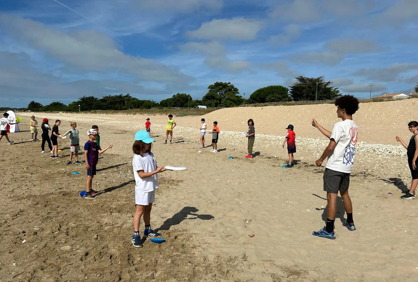 Coaching de jeunes sur le sable